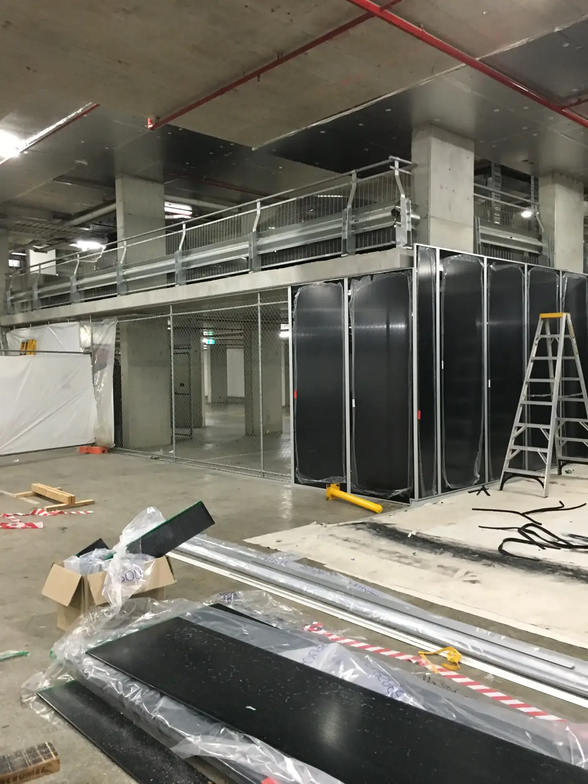 Industrial car wash bay fit out, Assembly: Installing polycarbonate wall systems